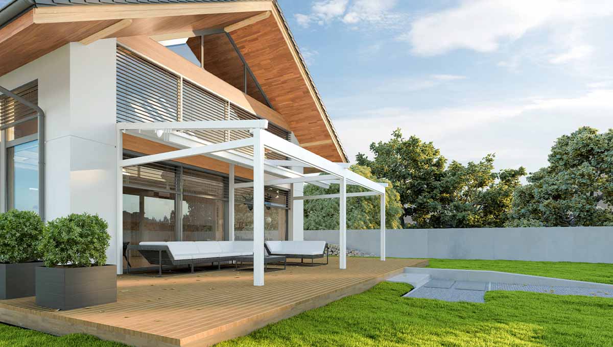 photo d'une pergola a toile adossée terrasse aménagée dans un jardin